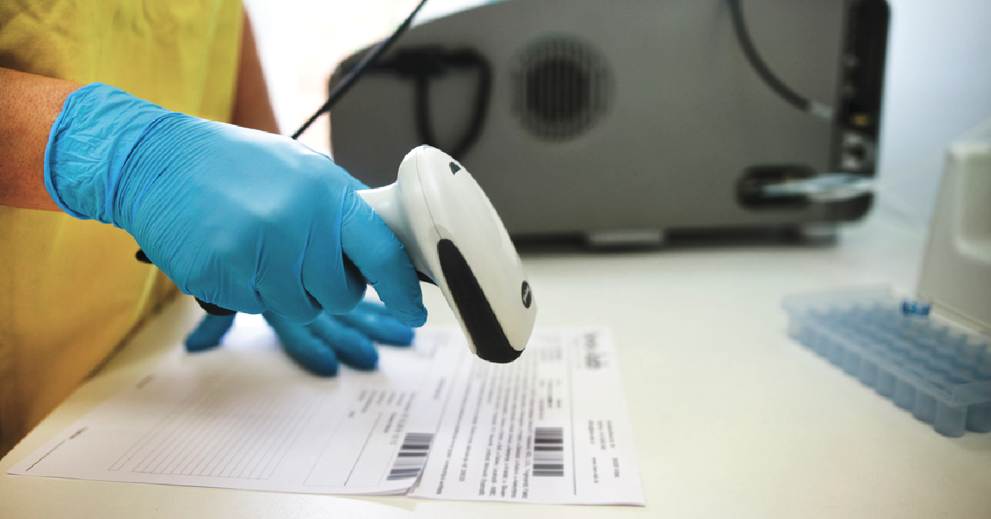 Medical staff scanning a medical bill barcode - avoiding medical upcoding an downcoding.