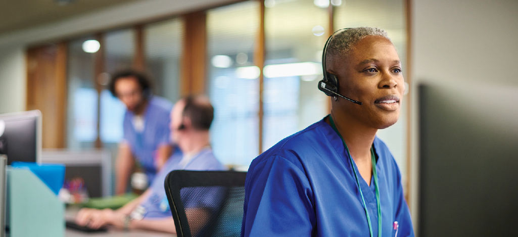 Addressing healthcare staffing shortages - Female healthcare operator speaking to a patient on the phone.