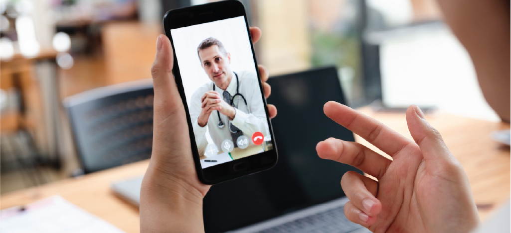 Improving patient engagement - Patient using a smartphone to speak with her doctor.