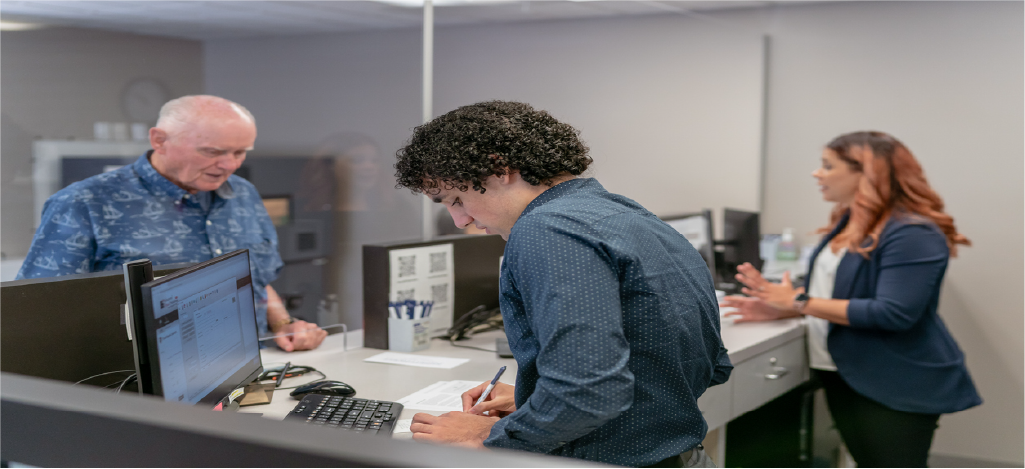  Hospital receptionists processing patient payments - using medical billing services and revenue cycle management services.