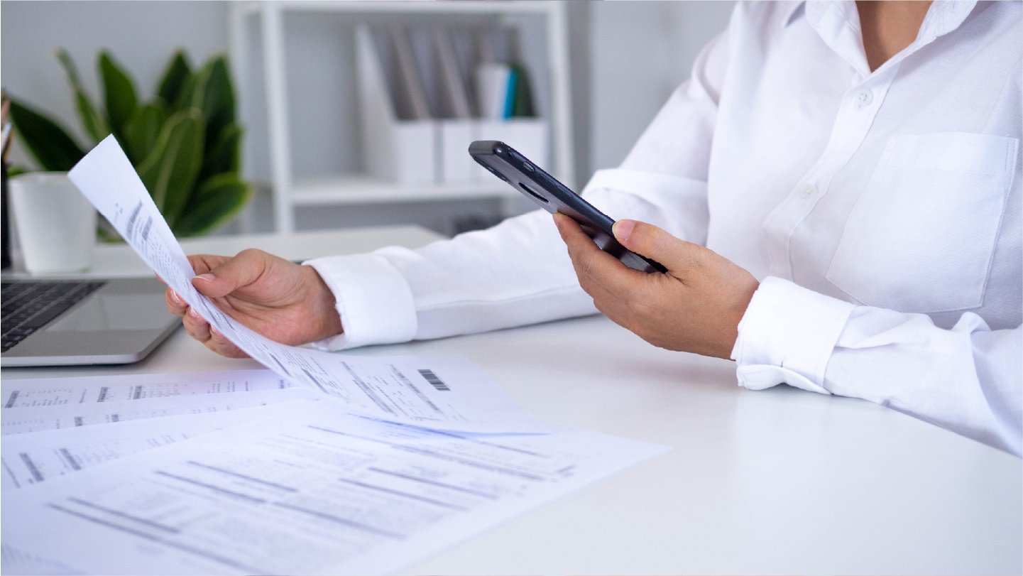 Patient paying healthcare payments with a phone and mailed statement. This is an example of Hybrid Billing