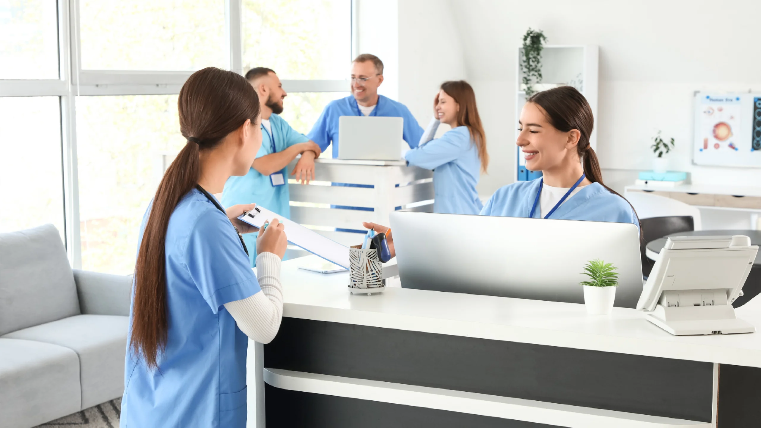 Office managers talking in a medical practice about the financial tightrope in healthcare