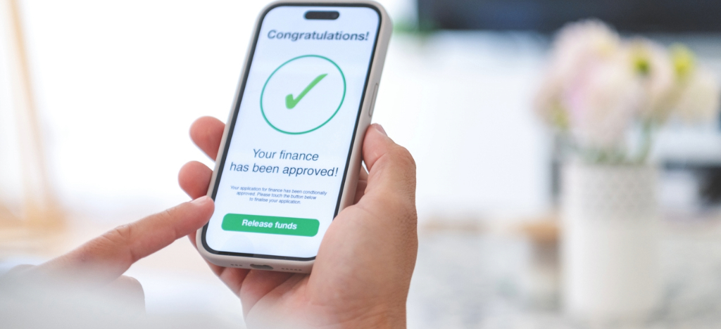 Hassle-free patient financing solutions - A man holding a smartphone showing medical financing approval.