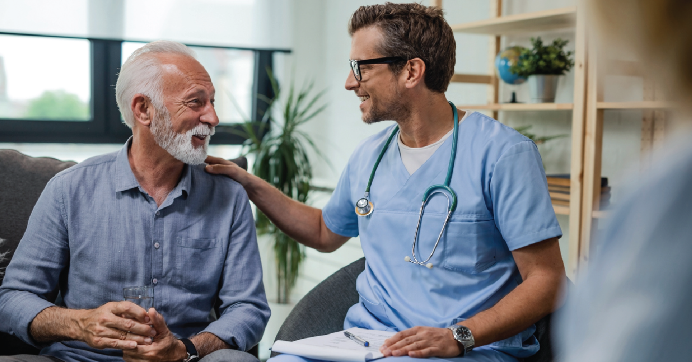 Doctor assisting a senior man during a medical checkup - compassionate patient collections concept.