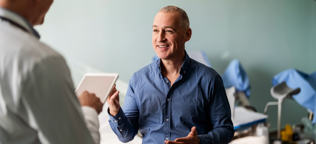 Payment options - A man talking to his doctor about payment plans.