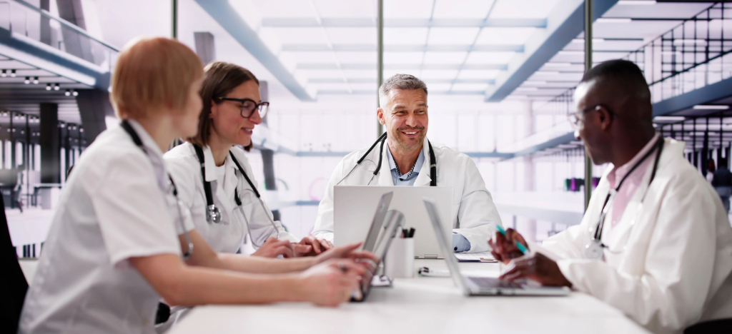 A group of medical professionals having a meeting about their practice’s revenue.