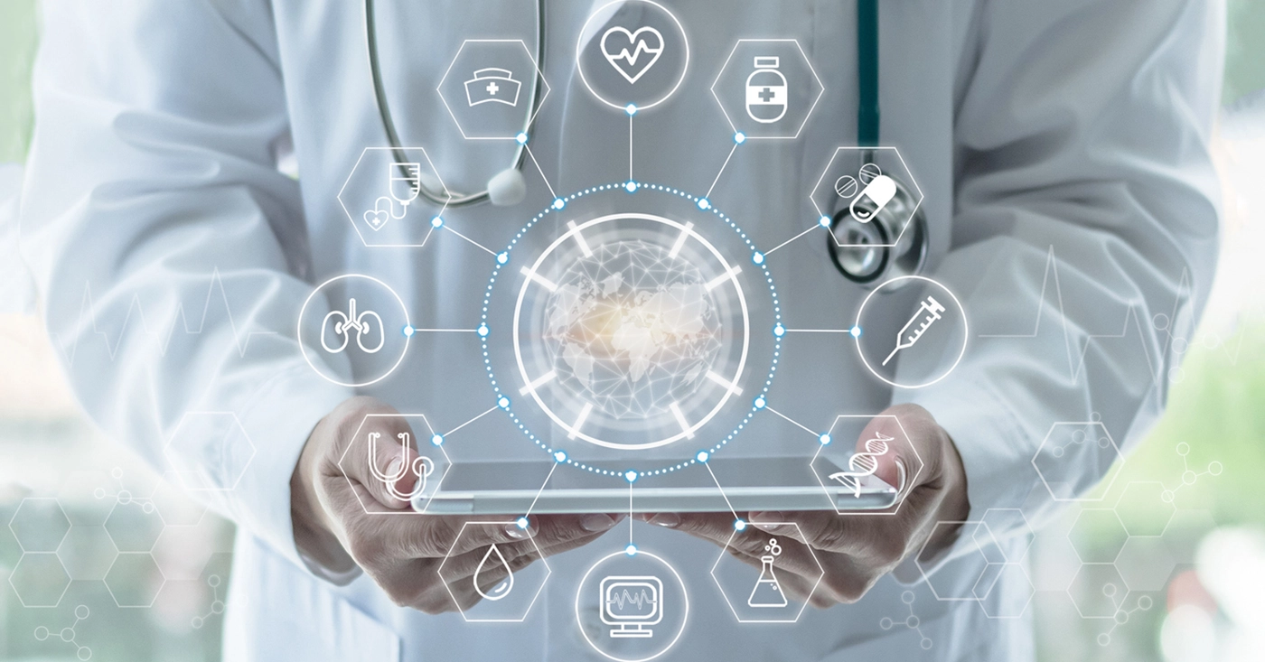 Technology impacts of RCM regulatory changes - Doctor holding a tablet device showing different medical software.