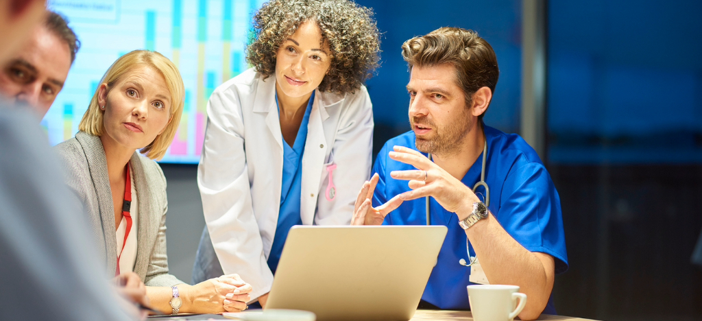 A team of doctors and business owners having a meeting about their practice’s revenue.