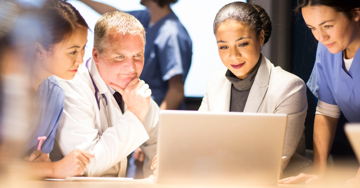 Revenue cycle metrics - A team of medical professionals reviewing their practice’s revenue cycle reports.