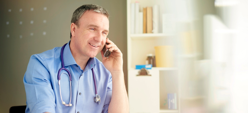 Merchant accounts for medical or dental practices - A doctor on a call with a merchant account provider.